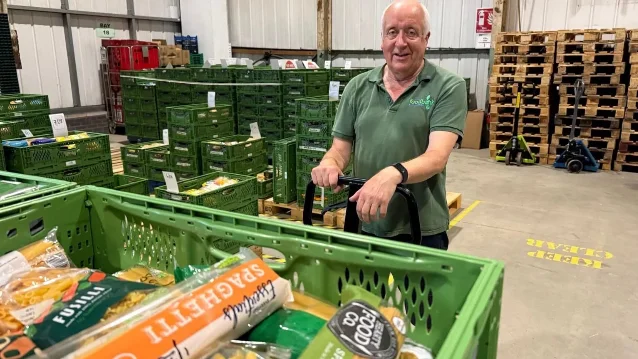 A Cardiff Foodbank volunteer with food supplies