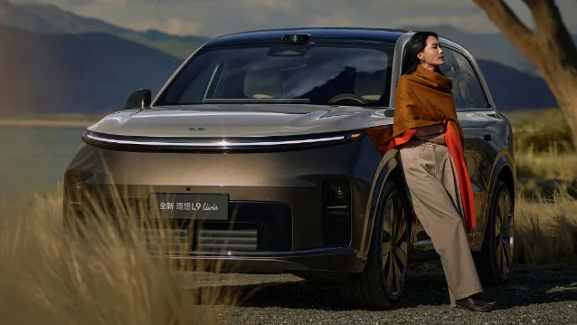New Li Auto L9 Livis flagship SUV at launch — two-tone silver-brown colorway with mountain lake backdrop. Source: eletric-vehicles.com