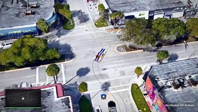 CrimeWorld gameplay in Miami Beach — real photogrammetry buildings, aerial view, police car with badge icon visible below