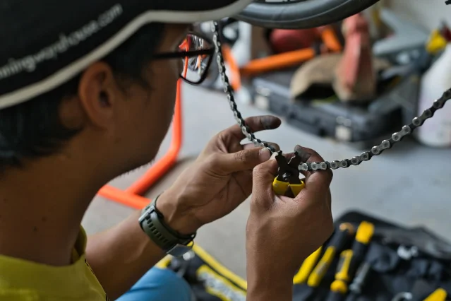 Mechanic checking a bicycle chain