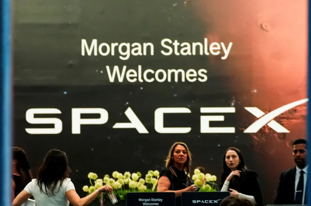 SpaceX IPO signage at the Morgan Stanley event in New York, with the Mars graphic visible in the background