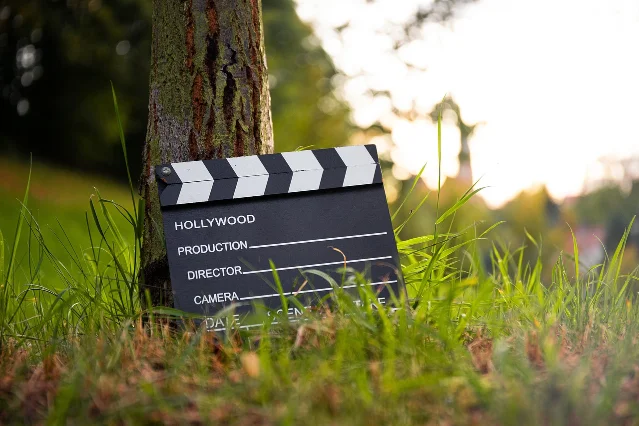 A blank movie clapperboard sits on a table — still waiting for a take.