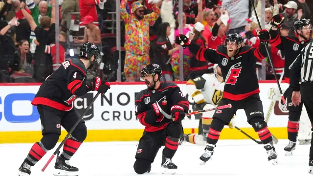 Seth Jarvis celebrates his power-play overtime game-winner in Game 2 at Lenovo Center, evening the series 1-1