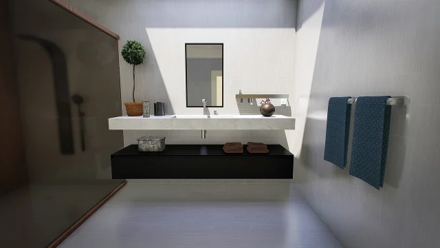 A clean modern bathroom with bright lighting and a glass shower enclosure