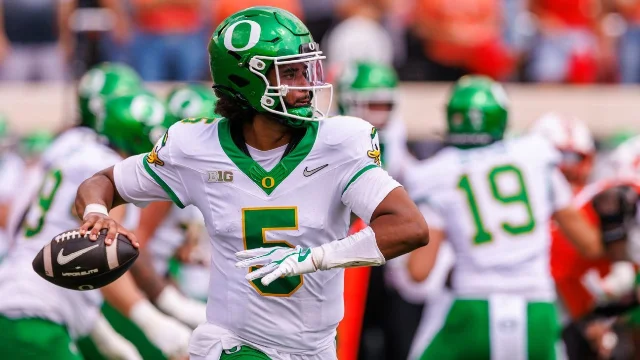 Dante Moore surveys the field during Oregon's road test at Oklahoma State