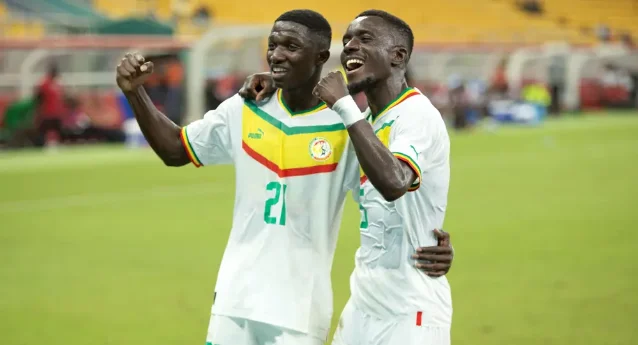 Lamine Camara of Senegal celebrates a qualifying goal