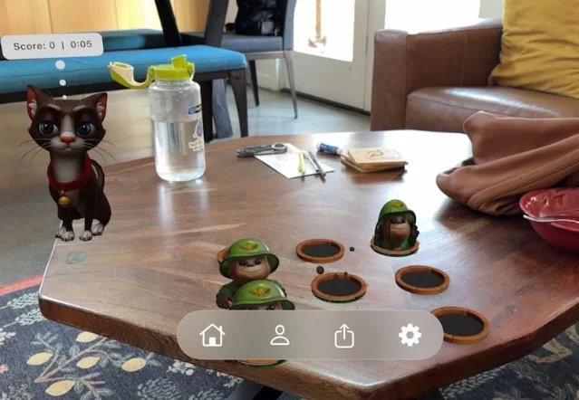 Pixi AR cat and whack-a-mole characters on a coffee table