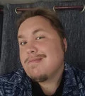 W. Josephus W., a young man in a patterned shirt, photographed in what appears to be a vehicle — the Bandcamp artist photo
