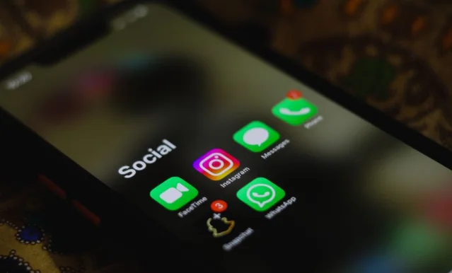 Smartphone screen showing social media app icons including Instagram and Snapchat