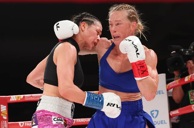 Holly Holm landing a right hand on Stephanie Han during their WBA lightweight championship rematch