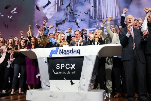 SpaceX CFO Bret Johnsen and President Gwynne Shotwell ring the opening bell at Nasdaq on June 12, 2026
