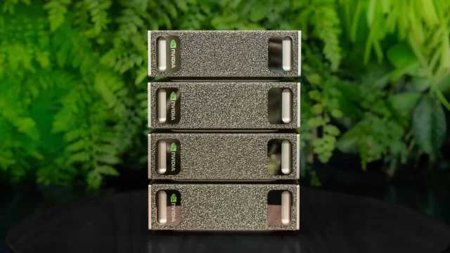 Four stacked NVIDIA DGX Spark desktop units on a dark surface with green foliage behind them