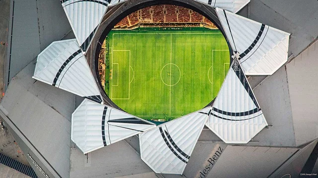 Aerial view of Atlanta Stadium with an open roof and a soccer field