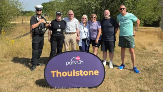David and Jackie Painter with PC Vicky Howick, PC Nick Slade and parkrun volunteers at Thoulstone Park.