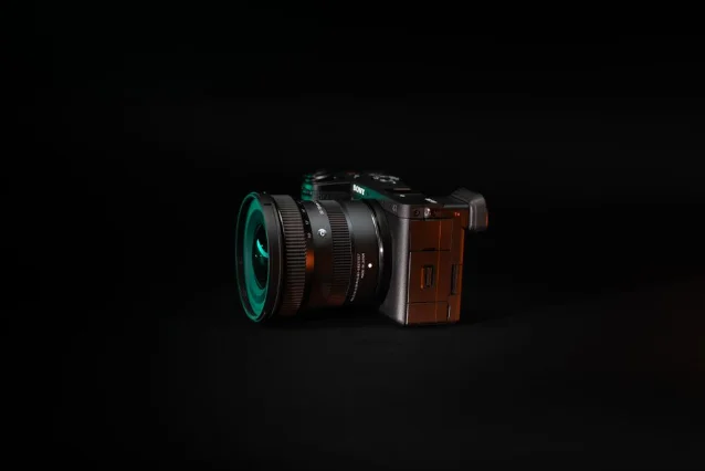 Sony mirrorless camera with wide-angle lens on black background