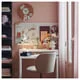LÄNGDHOPP pull-out desk in white, shown in a compact apartment workspace