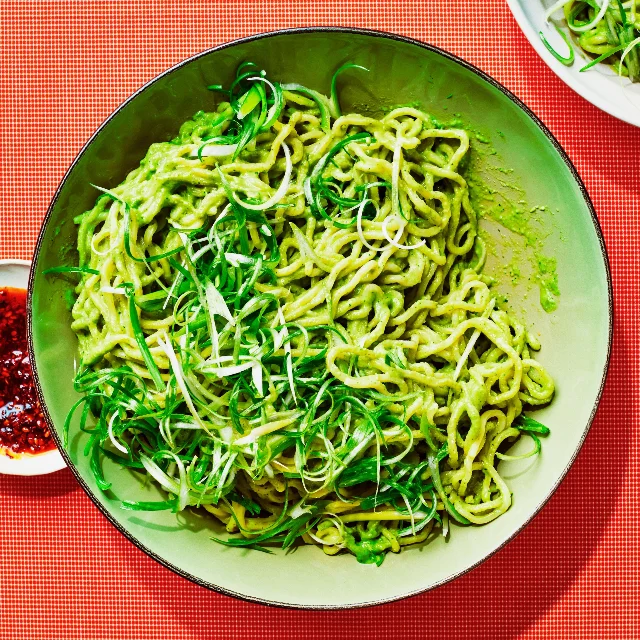 Miso peanut scallion noodles in a bowl with cilantro garnish