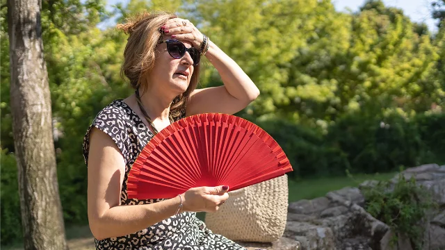 Watch for symptoms of overheating when you're outside on hot days.
