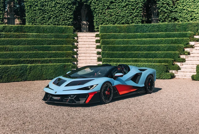 Lamborghini Fenomeno Roadster in light blue, parked in formal hedge garden