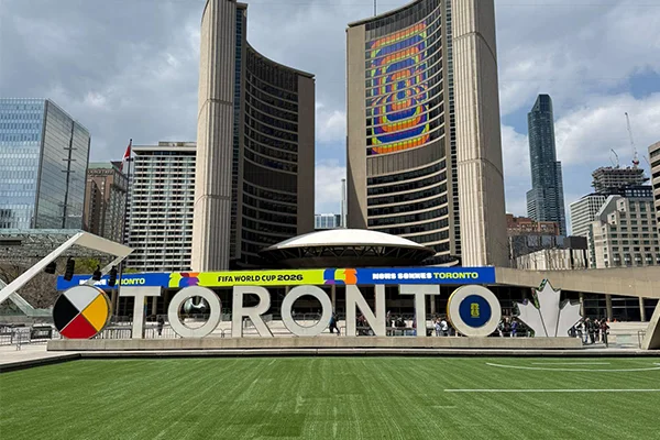 Nathan Phillips Square with FIFA World Cup branding on Toronto City Hall and a temporary soccer pitch