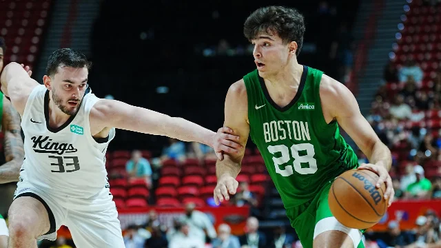 Boston Celtics wing Hugo Gonzalez drives against Sacramento Kings forward Alex Karaban in NBA Summer League action
