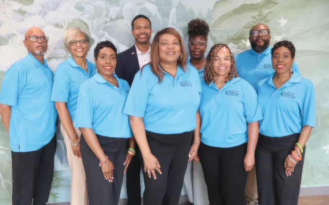 Dream Day Foundation staff pose at the organization's new home in the Nonprofit Center of East Alabama.
