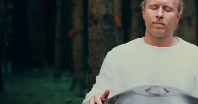 Insight Timer's Explore Video App Store banner: a man in a cream sweater playing a handpan drum outdoors, eyes closed.