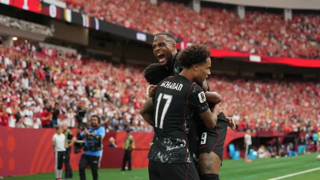 Canada players celebrate during the 6-0 win over Qatar