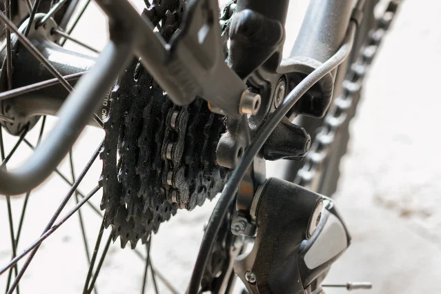 Close-up of a bicycle cassette, chain and rear derailleur