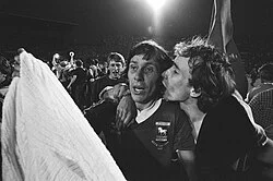 Arnold Mühren celebrates Ipswich Town's 1981 UEFA Cup victory in a black-and-white crowd scene