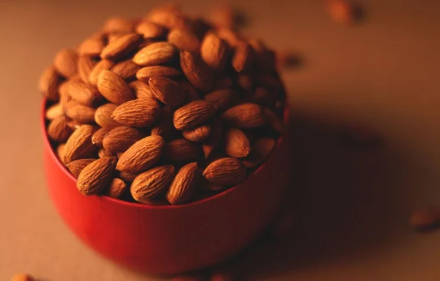 Almonds in a red bowl showing a practical serving