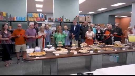 A wider view of the Community Bread Basket ribbon cutting
