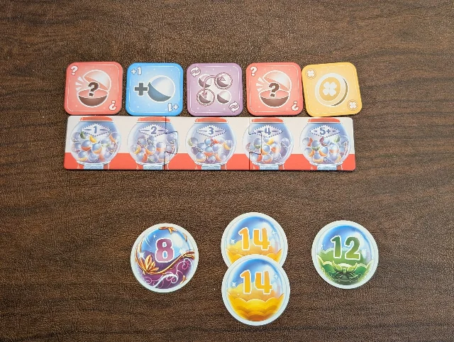 Capsule Collector setup with action tiles and a shared capsule queue on the table.
