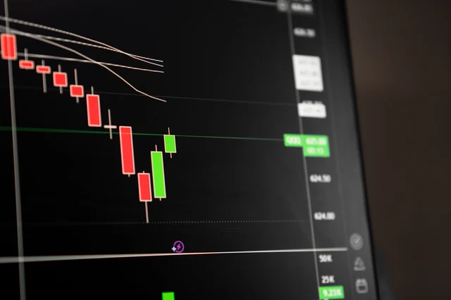 Candlestick chart on a dark trading screen showing a sustained bearish price trend