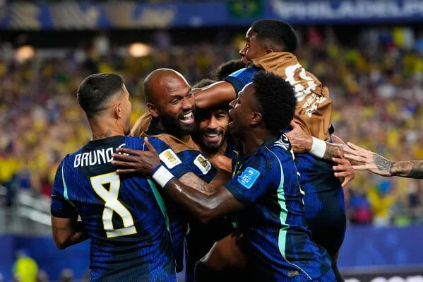 Brazil celebrate the result that keeps Group C tense