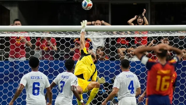 Cape Verde goalkeeper Vozinha makes a save during the Group H match against Spain in Atlanta.