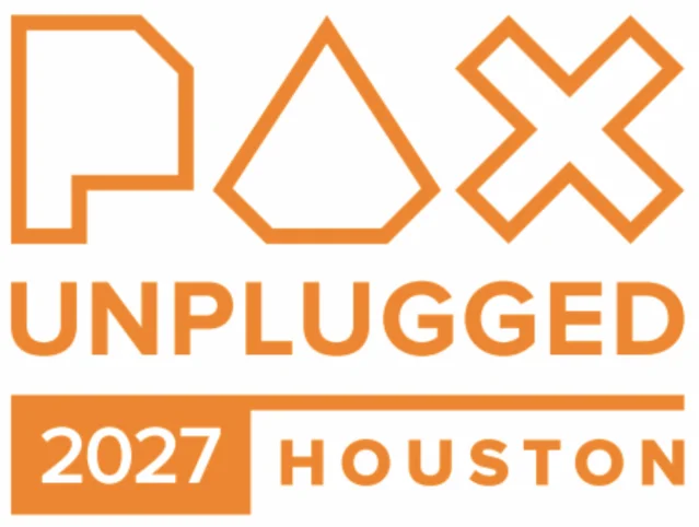 A crowded PAX Unplugged exhibition floor with demo tables and publisher booths