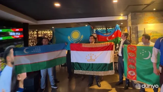 Uzbek fans gather around a World Cup screening
