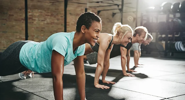 Active adults in a gym setting representing the 35-55 longevity consumer cohort driving biohacking supplement growth