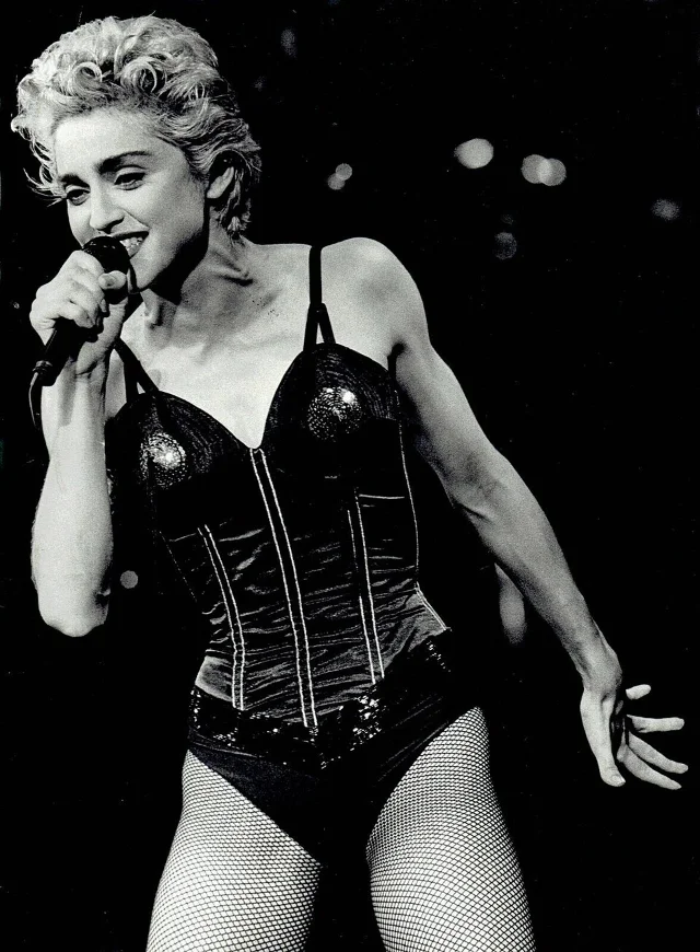 Madonna singing into a handheld microphone during a 1987 concert
