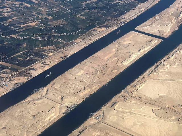 Aerial view of the Suez Canal with vessels moving through the waterway