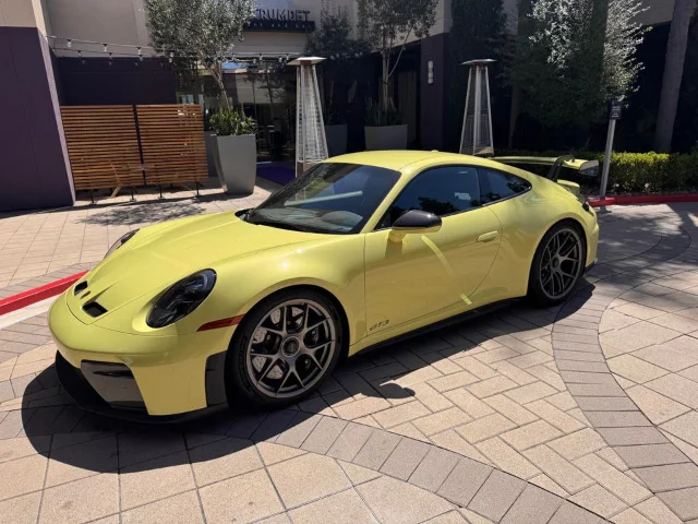 Yellow Porsche 911 GT3 parked outdoors