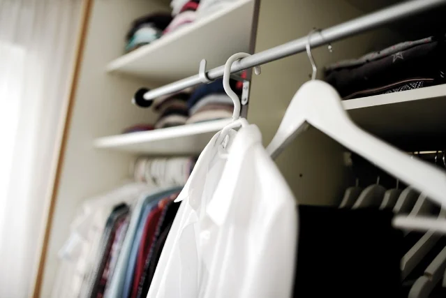 Tidy wardrobe rail with shirts on hangers