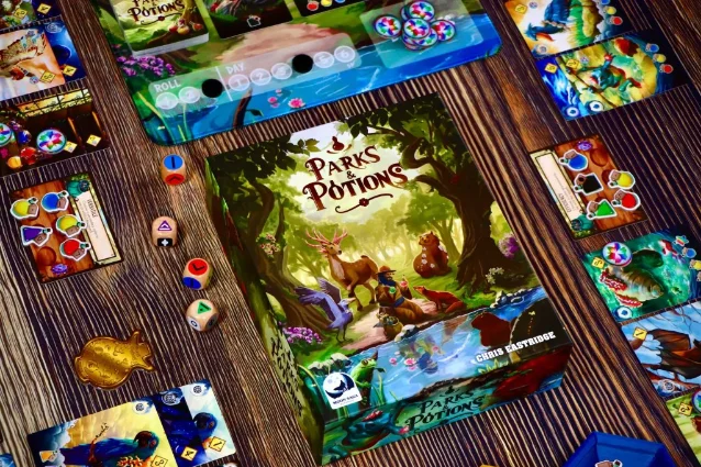 Parks & Potions setup with potion tokens, animal cards, and dice on a playmat
