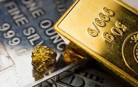 Gold bars — precious metals under pressure as rate-hike expectations rise