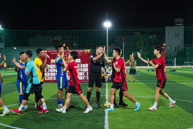 Generic post-match handshake on a football pitch