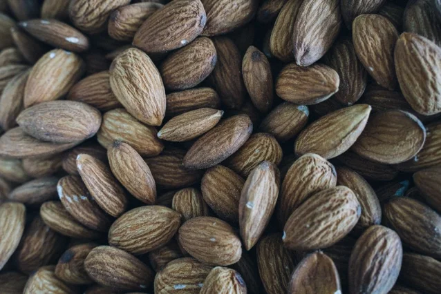 A close-up of raw almonds showing their natural texture