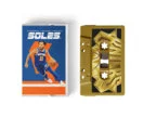 Cassette package variant — blue and orange Knicks colorway, gold-shell cassette tape, SOLES wordmark printed on spine