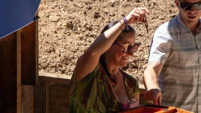 Tonia Weakland holds the key to her rebuilt Boulder Creek home.
