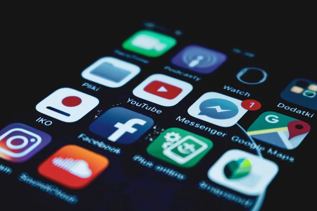 Close-up of a smartphone screen showing social media and app icons